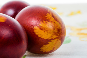 Easter eggs colored in onion peelings and some grass used for decoration.