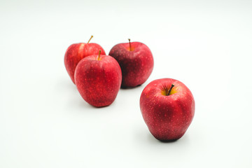 Red apple shot on a white isolated background.