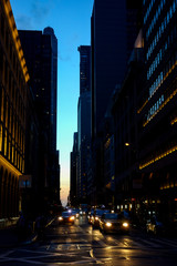 New york with sunset in the street with car headlight