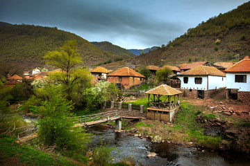 Old rustic idyllic houses in a village Topli do on Old Mountain (stara planina) in Serbia