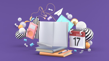 The book is surrounded by music players, calendar and stationery on a purple background.-3d rendering.