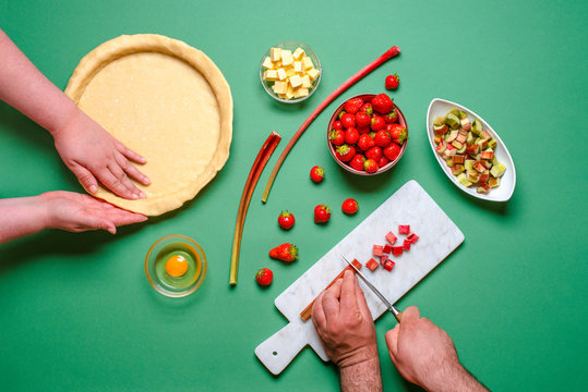 Making A Pie Top View. Young Couple Home Baking