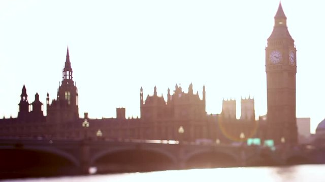 Big Ben and houses of parliament sunset with a busy bridge on tilt shift lens soft focus