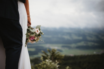 photo of a bride and a groom in the nature