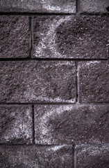 white spots on the stone wall of the building