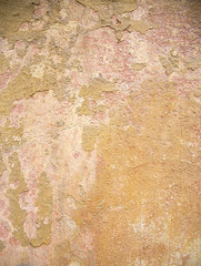 old wall of a building with old cracked paint