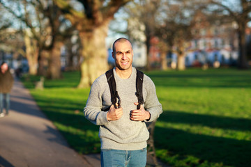 young man walking in the park