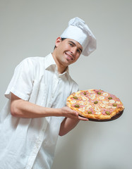 portrait cook with pizza on a light background