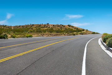 Empty paved road in the Mojave Desert in Victorville, California