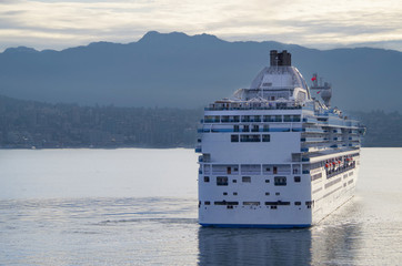 Modern white Princess Cruises cruiseship or cruise ship liner Island Princess arrival into port of...
