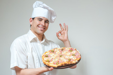 portrait cook with pizza on a light background