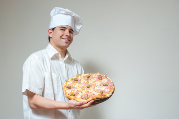 portrait cook with pizza on a light background