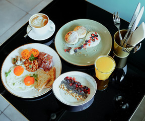 Dish breakfast dinner time plate table black coffee juice musli eggs bread cheesecakes porridge macaroni water menu for cafe restaurant 