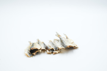 Dried Silver-stripe round herring shot in a white isolated background