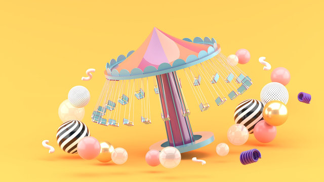 fairground rides surrounds many colorful balls on an orange background.-3d rendering..