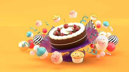 Chocolate cakes and strawberries surrounded by cupcakes and colorful balls on an orange background.-3d rendering..