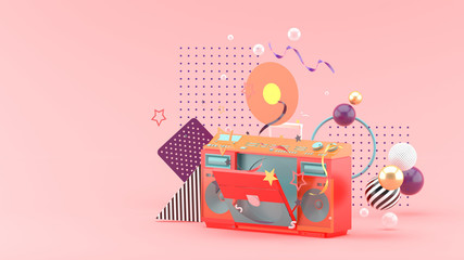 Radio and record among colorful balls on a pink background.-3d rendering..