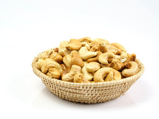 Cashew nuts on a cane, isolated on white background, healthy protein and fat sources.