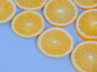 Retro style slices of orange on blue