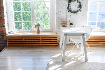 Stylish loft modern home office interior. Spacious design apartment with light walls large windows...