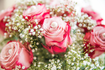 Culture Pearls on Fresh Pink Roses and Gypsophila Bouquet