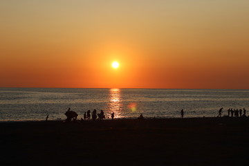 Fototapeta na wymiar sunset on the beach of abkhazia