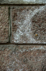 Texture of concrete brick wall with many small stones.