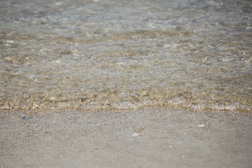 Beautiful detail of sea wave washing ashore on a beach (Zeeland, Netherlands)