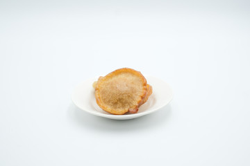 Pinjaram, penyaram of penjaram, a traditional bajau or suluk or sea bajau tribe traditional cuisines, shot on a white isolated background.