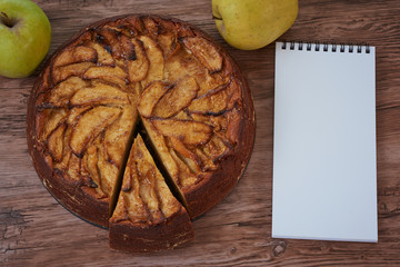 Homemade apple pie with a wooden base