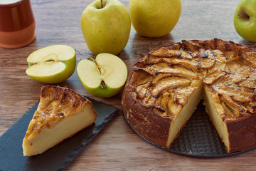 Homemade apple pie with a wooden base