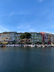 colorful houses and blue sky and yachts