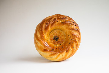 Uzbek national bread on a white background