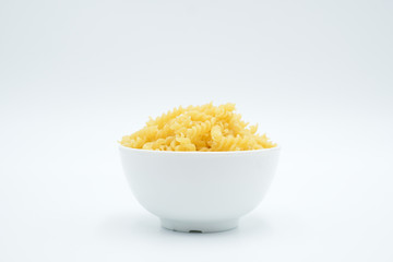 Twisted macaroni shot on a white isolated background.