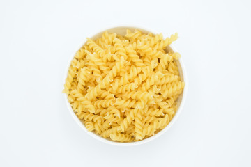 Twisted macaroni shot on a white isolated background.
