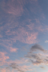 pink clouds in the blue sky
