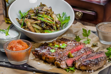 A bowl of steak on a table