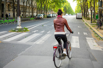 young woman riding a bicycle