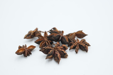 Obraz premium Star Anise or Bunga Lawang shot on a white isolated background.