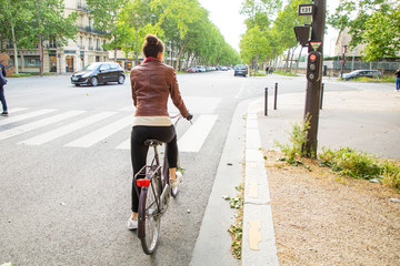 Naklejka premium young woman riding a bike