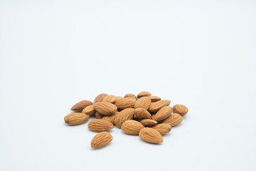 Badam or Almonds shot on a white isolated background.