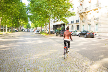 young woman riding a bike