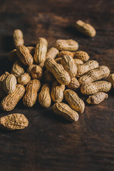 Shelled peanuts on a rustic wooden table