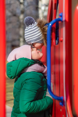 Fototapeta premium Little son kisses mom in the nose at the playground