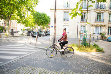 Fototapeta na wymiar young woman riding a bike