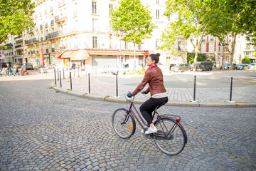 Fototapeta na wymiar young woman riding a bike