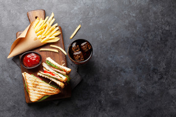 Club sandwich, potato fries chips and cola