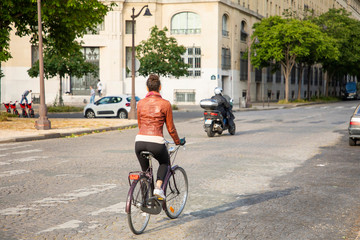 young woman riding a bike