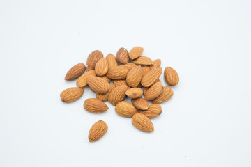 Badam or Almonds shot on a white isolated background.