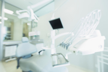 Blurred dentistry room with modern equipment for making operations